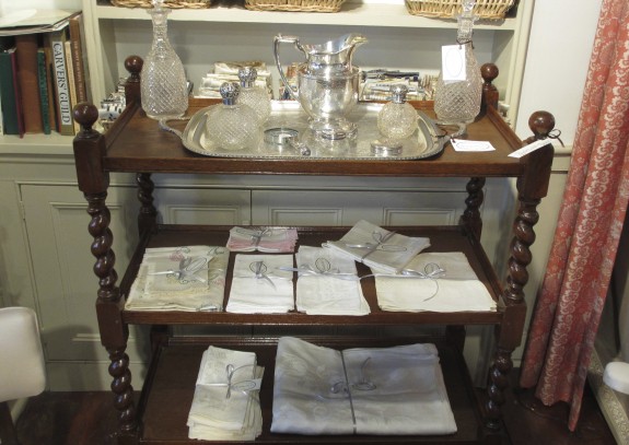 English Oak Etagere filled with a Collection of Antique Linens, Silver and Crystal